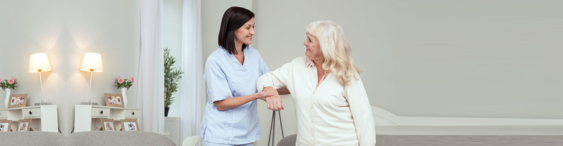 caregiver assisting senior woman